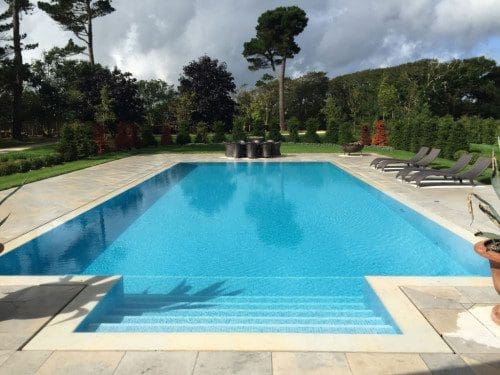 Outdoor slotted overflow swimming pool